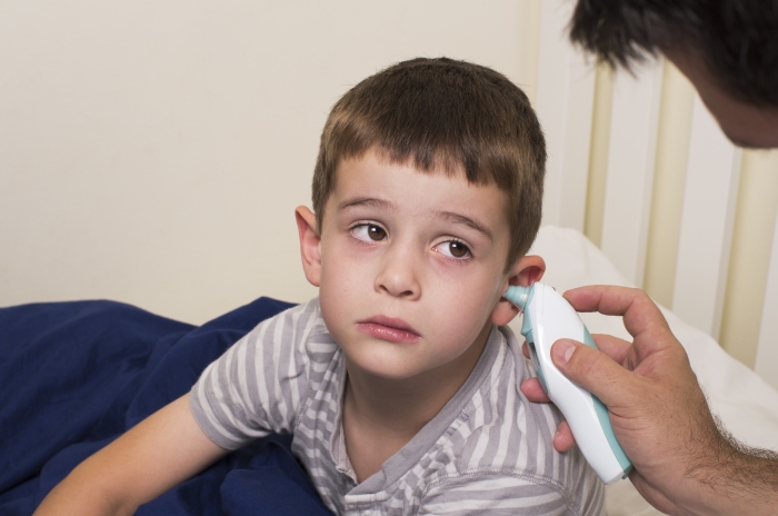 boy having his temperature checked